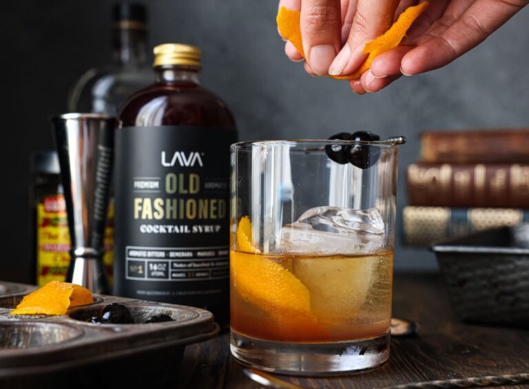 Capturing the art of making an old-fashioned cocktail with a citrus twist and premium cocktail syrup.